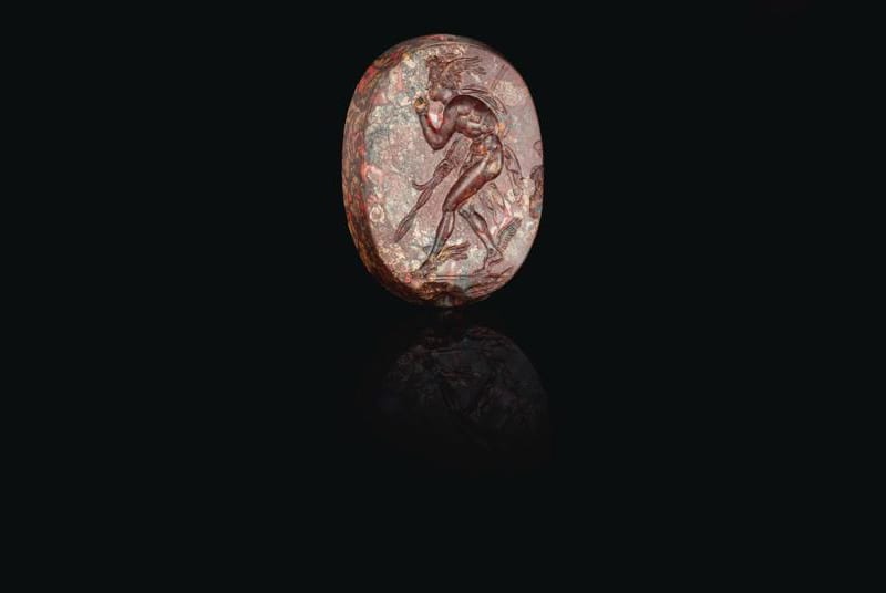 A Greek Mottled Red Jasper Scaraboid With Perseus