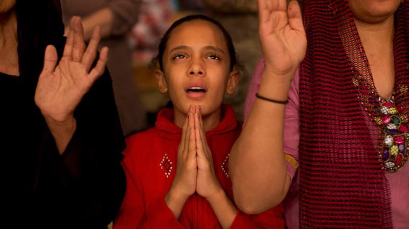 Coptic worshippers using same hand gesture as pharaohs.