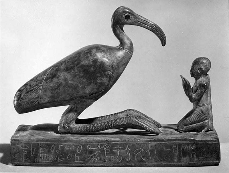 Statuette of a man worshipping Thoth as an ibis.