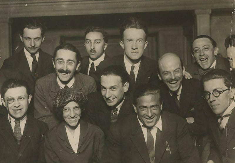 Dada artists, group photograph, 1920, Paris. From left to right, Back row: Louis Aragon, Theodore Fraenkel, Paul Eluard, Clément Pansaers, Emmanuel Fay (cut off). Second row: Paul Dermée, Philippe Soupault, Georges Ribemont-Dessaignes. Front row: Tristan Tzara (with monocle), Celine Arnauld, Francis Picabia, André Breton.