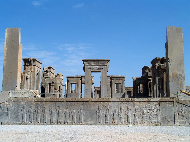 Tachara Palace in Persepolis with a bas-relief in the foreground