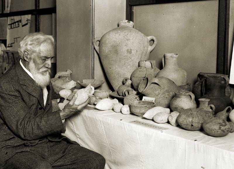 Flinders Petrie examining some of his finds, 1930.