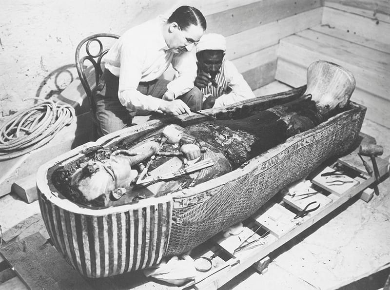 Howard Carter examining the sarcophagus of Tutankhamun, 1925