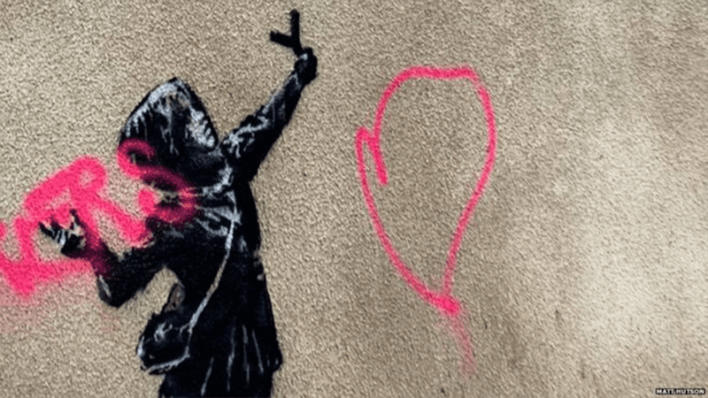Close-up of the mural after being vandalized