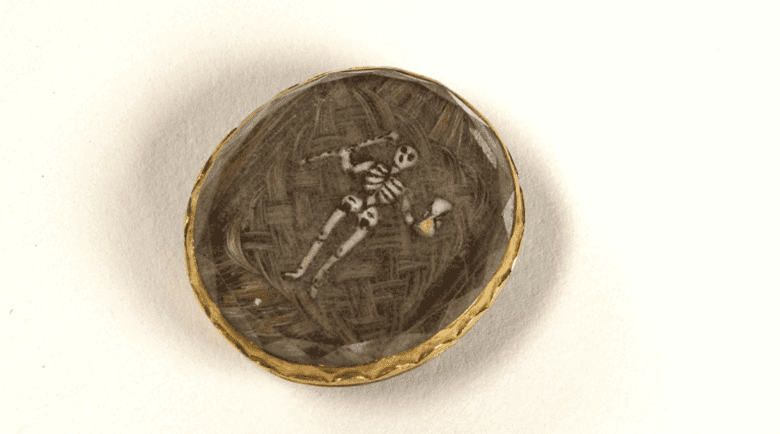 Mourning brooch containing the hair of a deceased relative. 