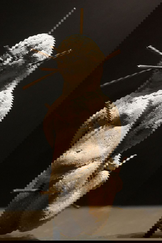 A voodoo doll with bound arms and needles, via Wikimedia