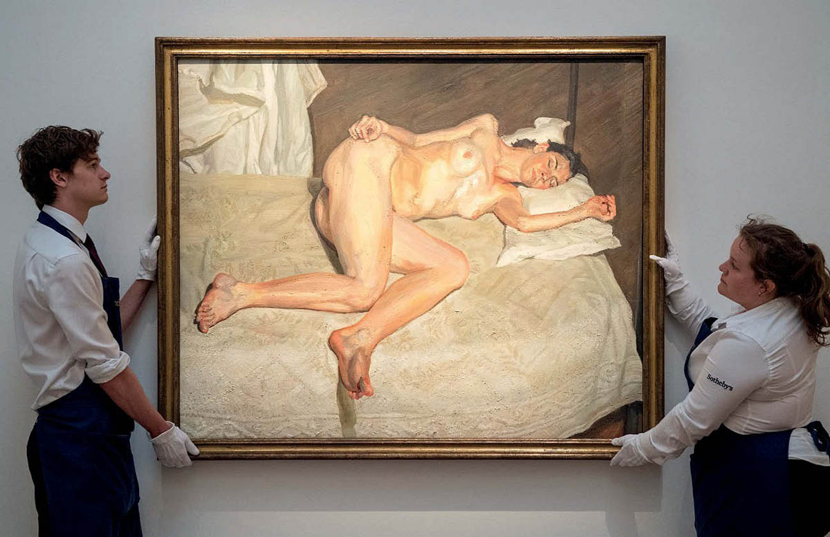 photograph of a painting of a nude woman on a bed