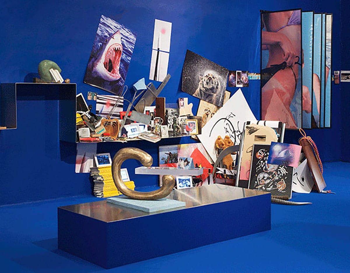 image of an exhibition work, many photos scattered and arranged