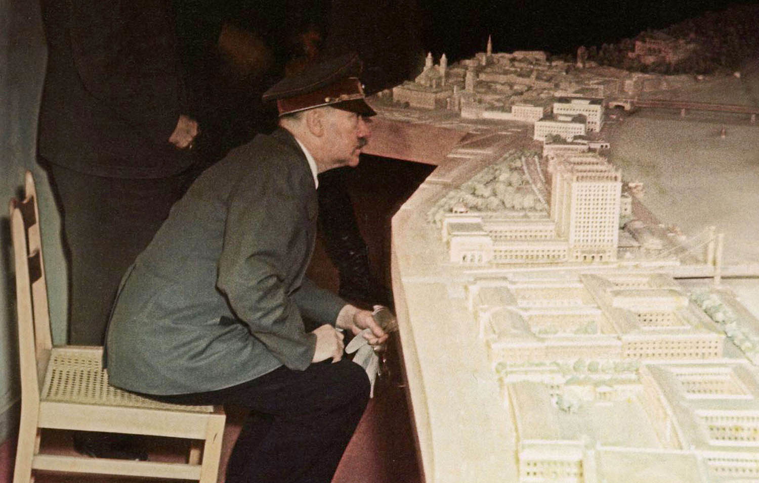 Adolph Hitler looking at model Führermuseum Linz in bunker 1945