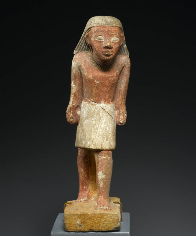 statuette striding man