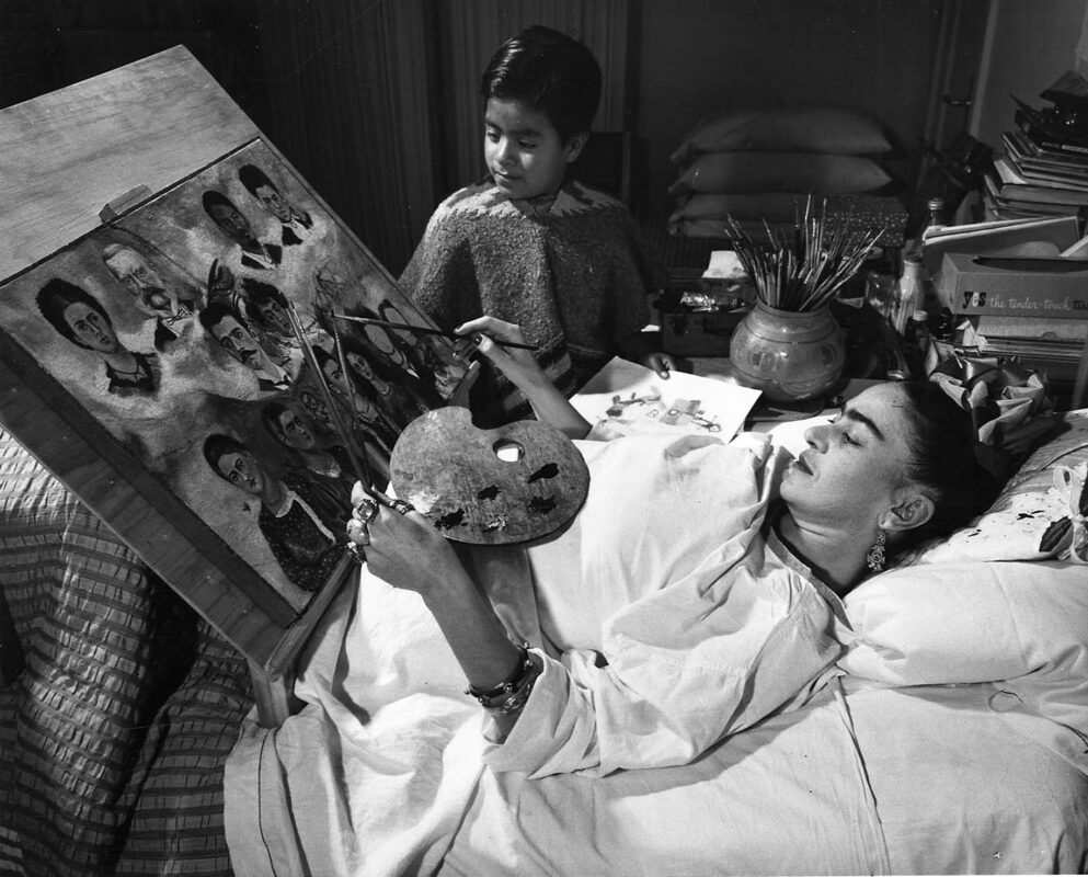 frida kahlo painting in bed