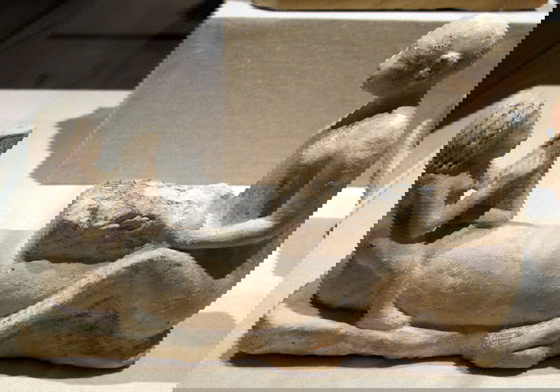 man woman large phallus terracotta figurine