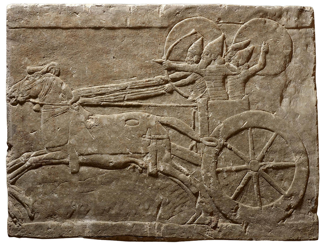 wall relief depicting assyrian chariot