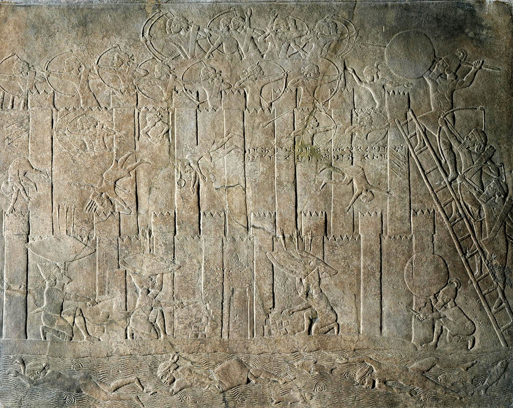wall relief depicting assyrians capturing city