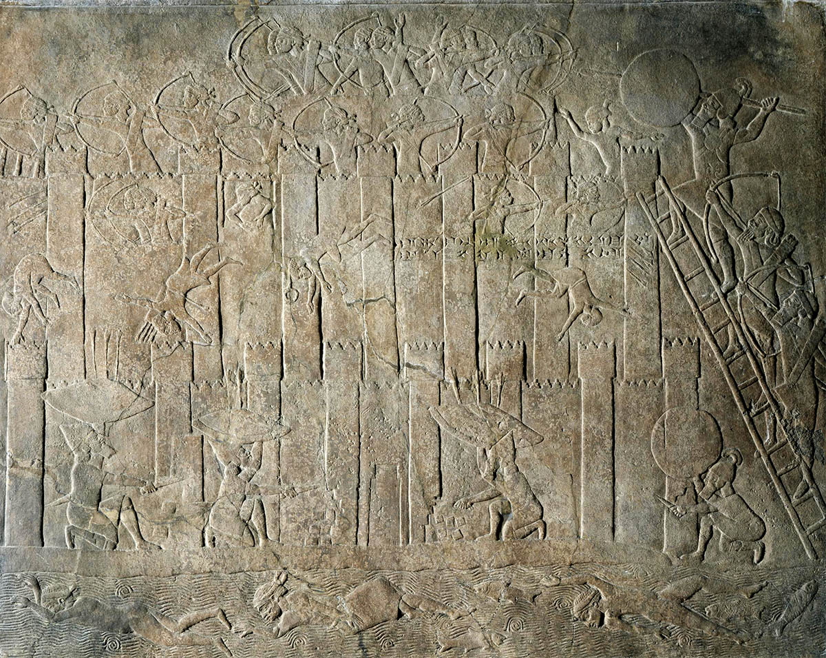 wall relief depicting assyrians capturing city
