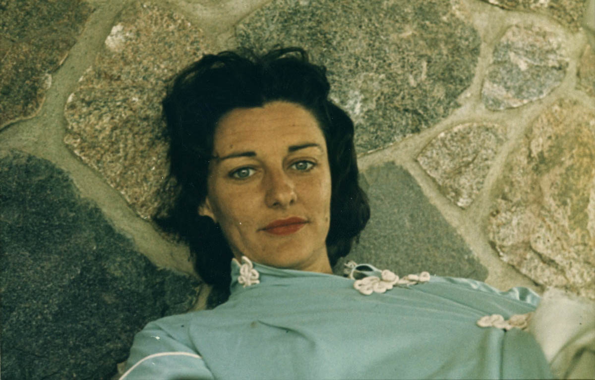 anne sexton in blue on stone floor