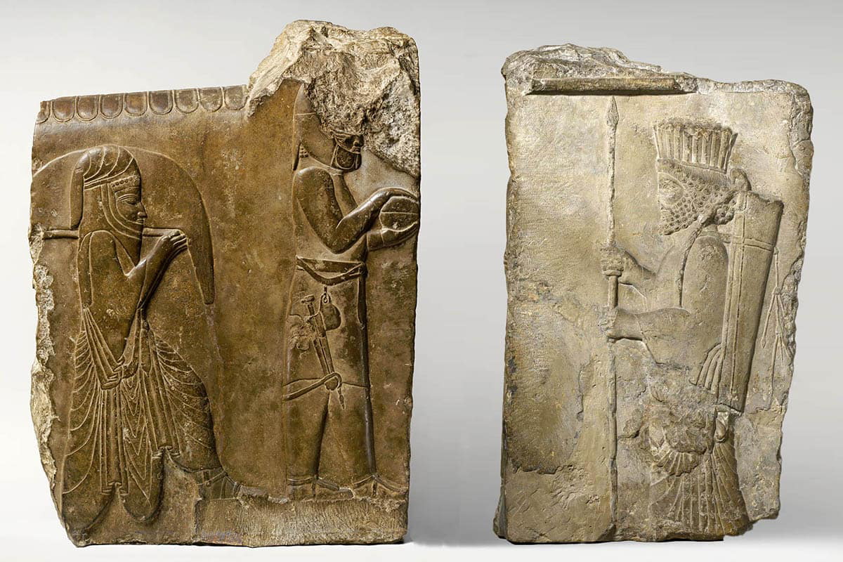 mesopotamian relief depicting two servants and persian guards