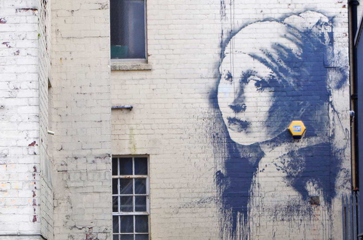 banksy girl with pierced eardrum