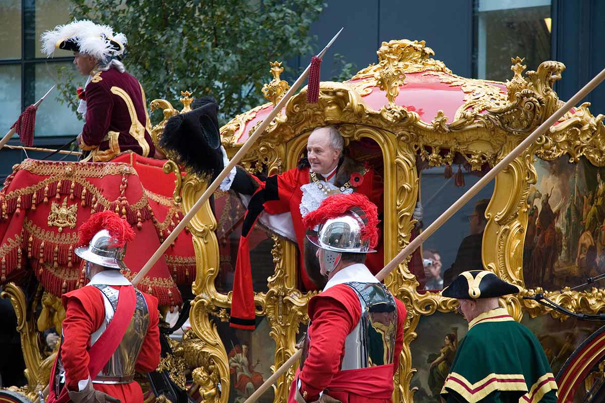 The Lord Mayor of London, David Stuttard, waves to the crowds during the 2006 Lord Mayor's Show