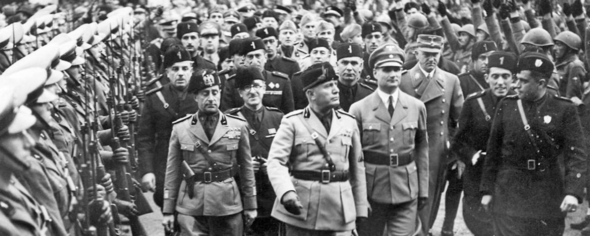 benito mussolini inspects italian troops