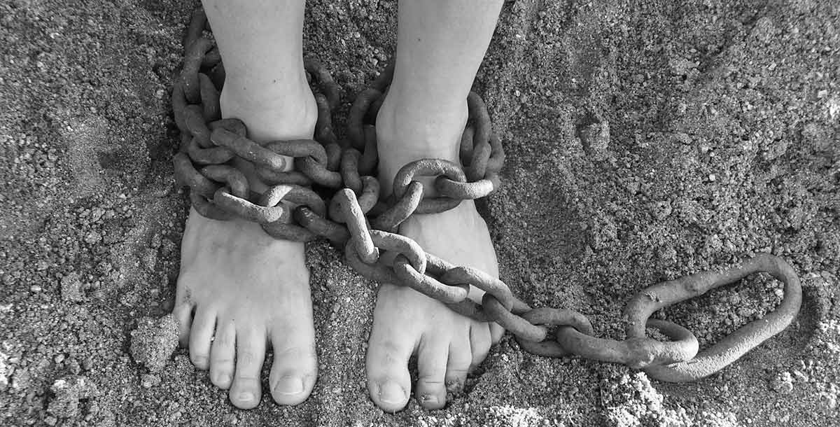 chains-feet-sand-photograph