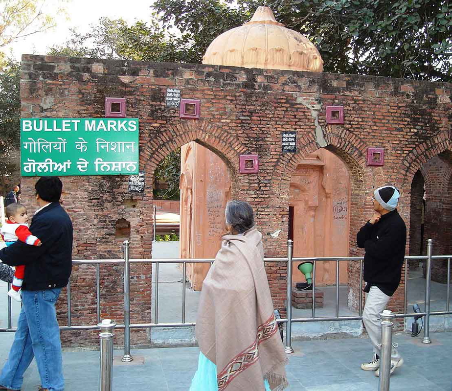 Bullet marks on a preserved wall at Jallianwala Bagh (2007), via Wikimedia Commons