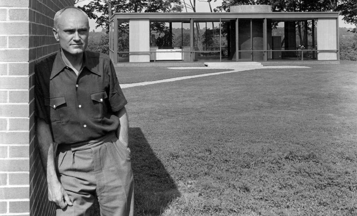 philip johnson in front of glass house