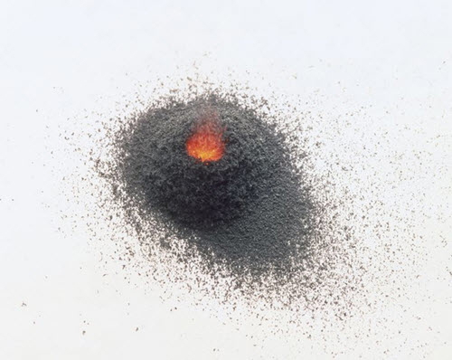 small burning gunpowder pile