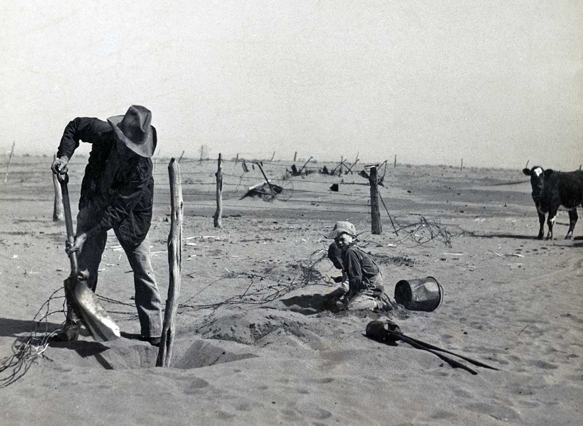 dust bowl farmer raising fence post oklahoma