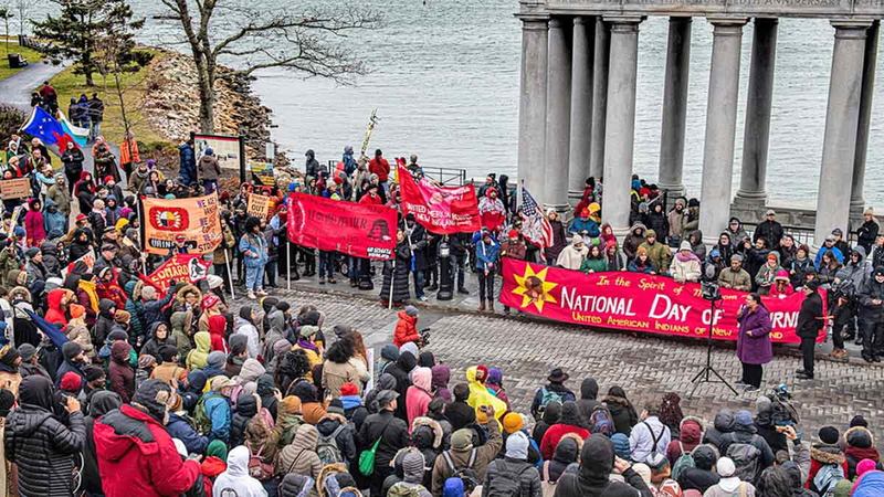 Protestors gather for the National Day of Mourning on Cole’s Hill