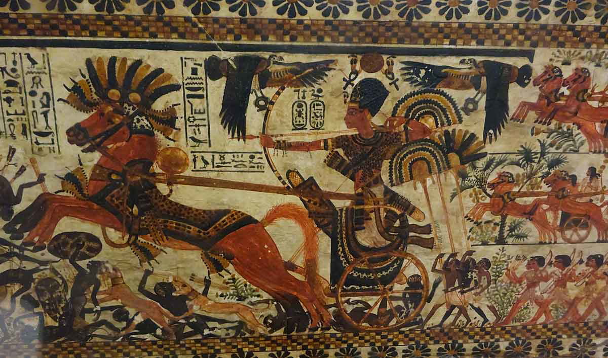 Funerary artwork depicitng Tutankhamun chasing down enemies on a chariot