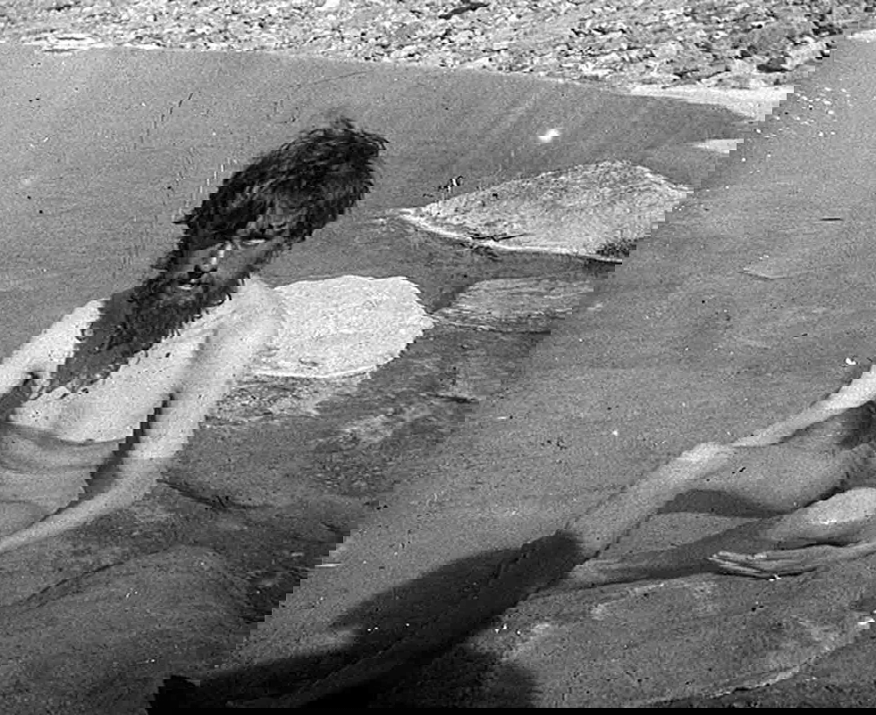 Crowley bathing in a spring close to the K2 basecamp (1902) 