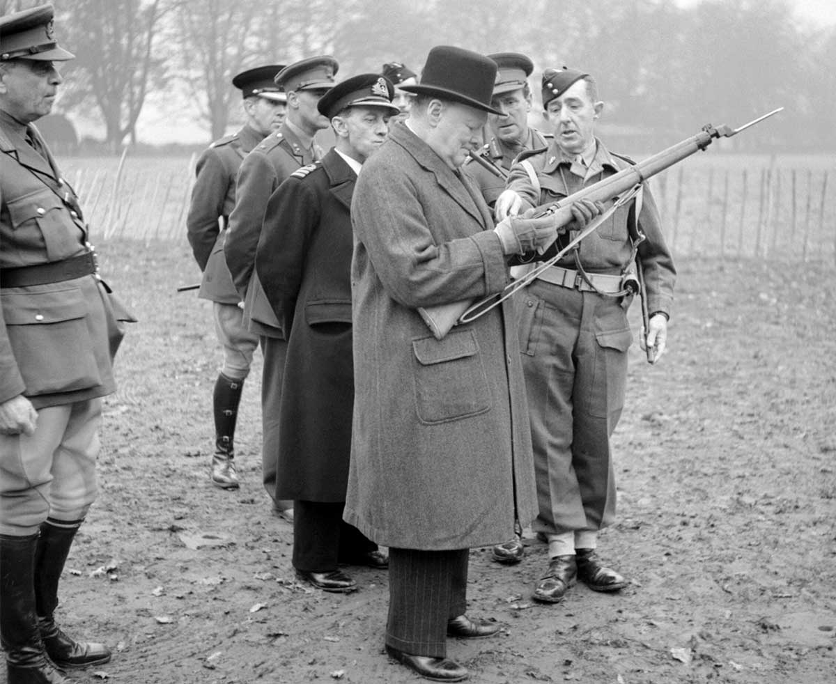 churchill inspects a rifle 1942