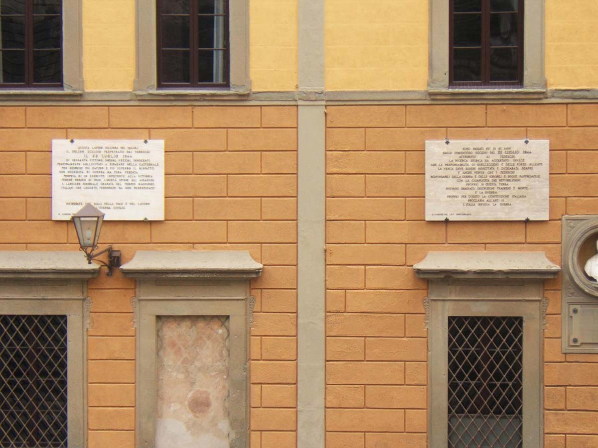 two plaques on wal san miniato town hall