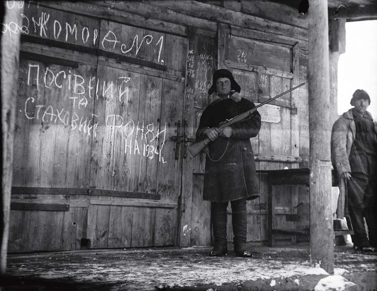 soldier guarding grain during holodomor photo