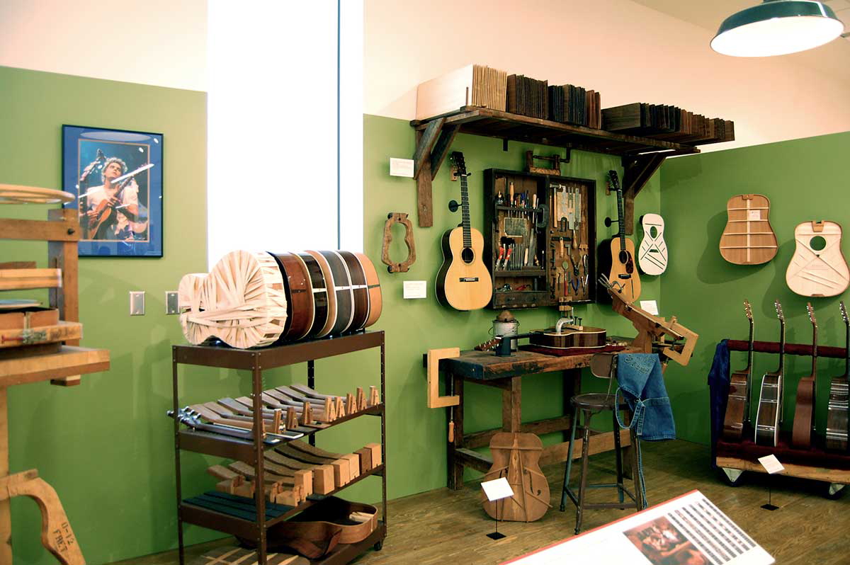 A section of the original Martin guitar workshop, note the iconic X brace design, far right, Source: Wikimedia Commons
