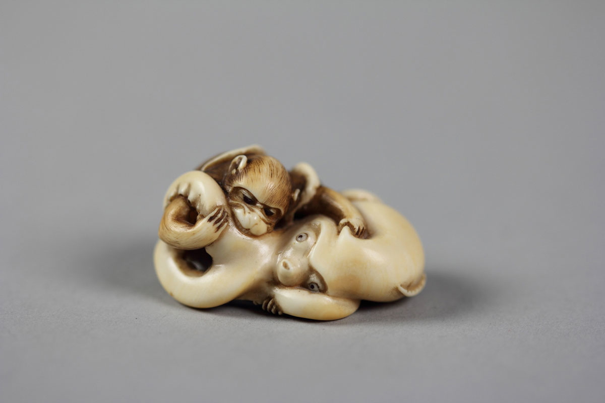 netsuke monkey fighting octopus