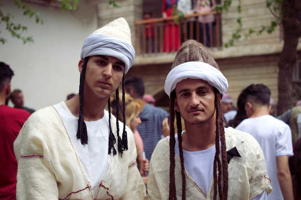 two yazidi men traditional dress
