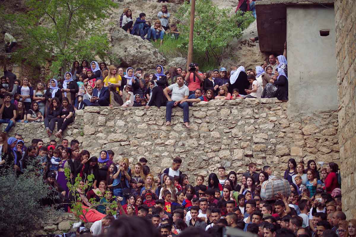 yazidi new year sitting on wall