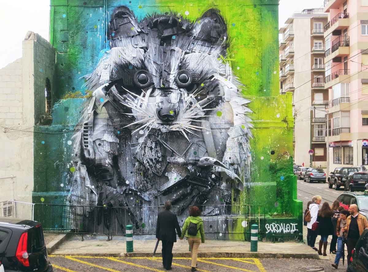 big raccoon bordalo street art