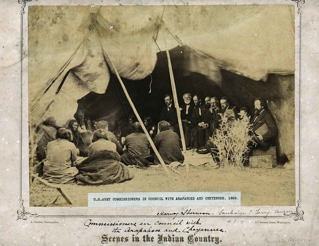 US Army Commissioners in council with the Cheyanne and Arapaho at Fort Laramie, 1868. Source Wikimedia Commons