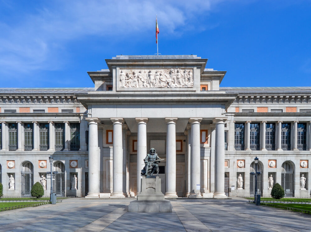 The exterior of the Prado Museum in Madrid with statue of Velázquez.