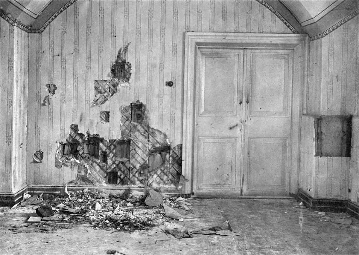 The basement room of Ipatiev House, bearing the damage from the Romanov assassination. Source: rusarchives.ru/Wikimedia Commons.