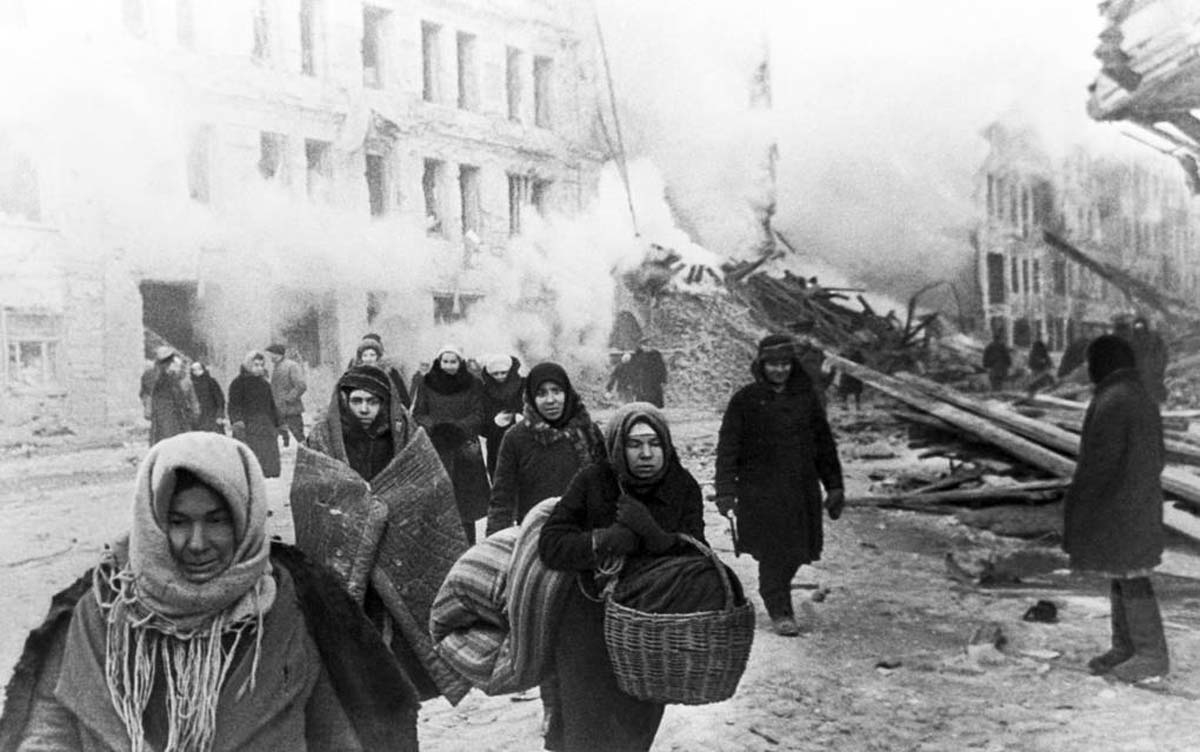 residents leaving destroyed building