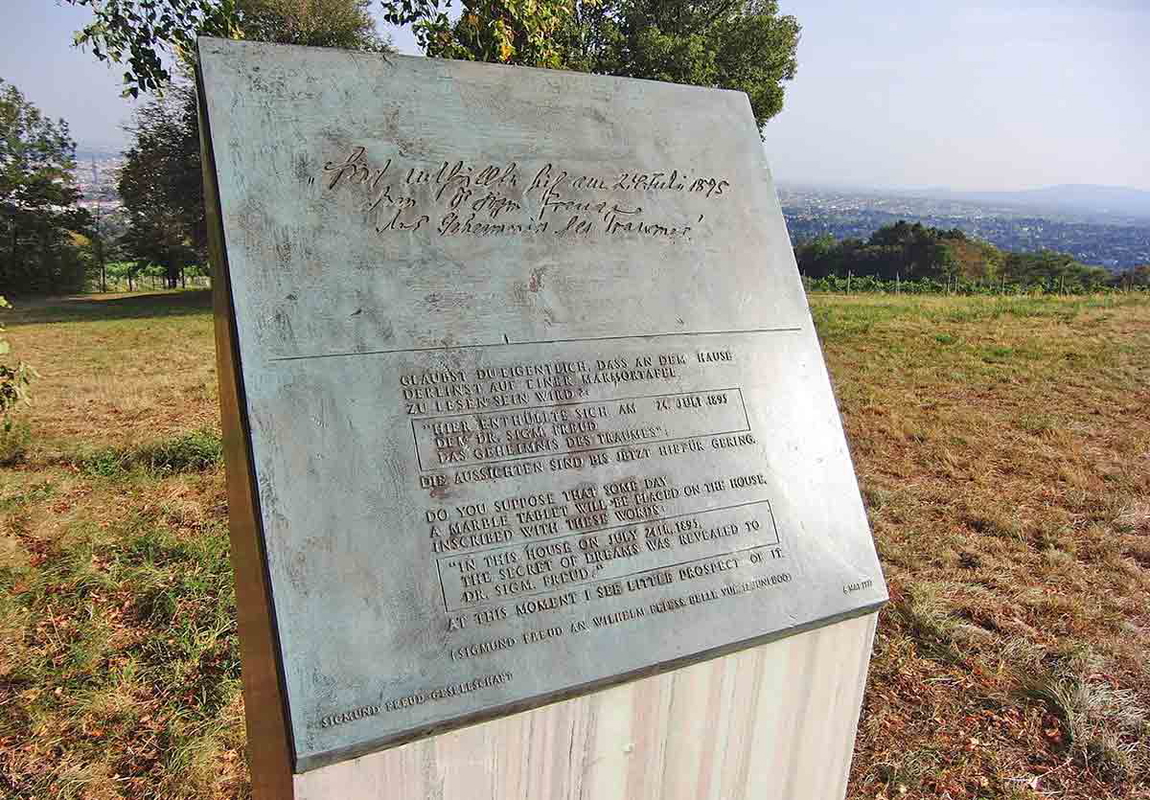 A plaque commemorating Freud’s Irma’s Injection dream, inscribed with “In this house on July 24th, 1895, the secret of dreams was revealed to Dr. Sigm. Freud.”. Source: Wikimedia Commons