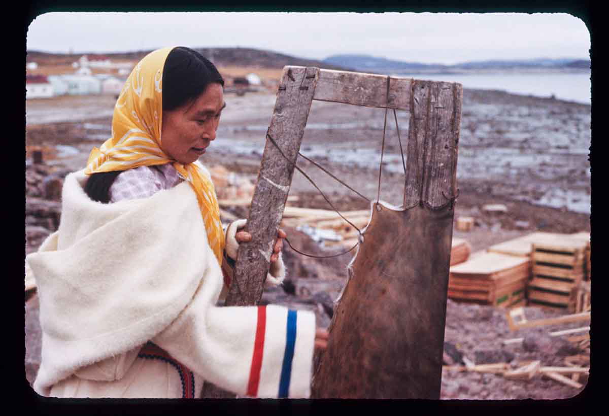 inuit woman working with sealskin