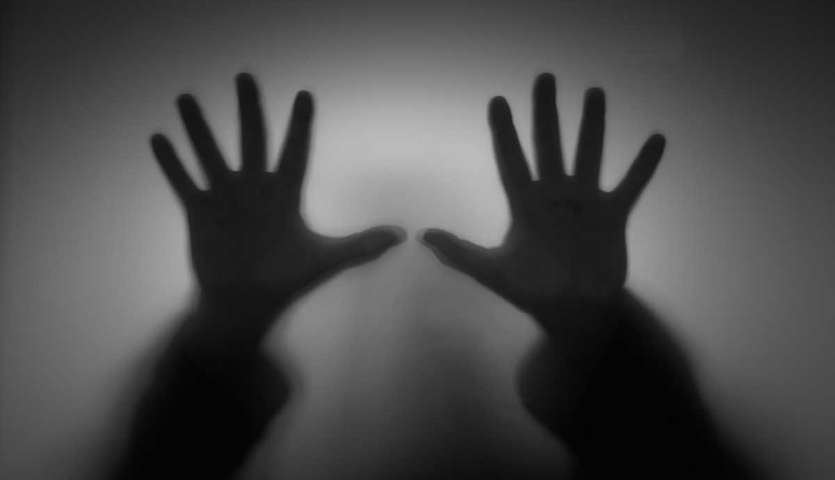 origins of true crime genre shadow hands