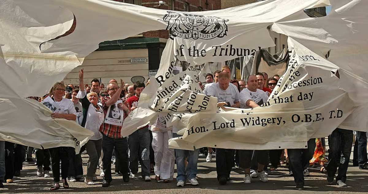 crowds burst banner representing widgery report