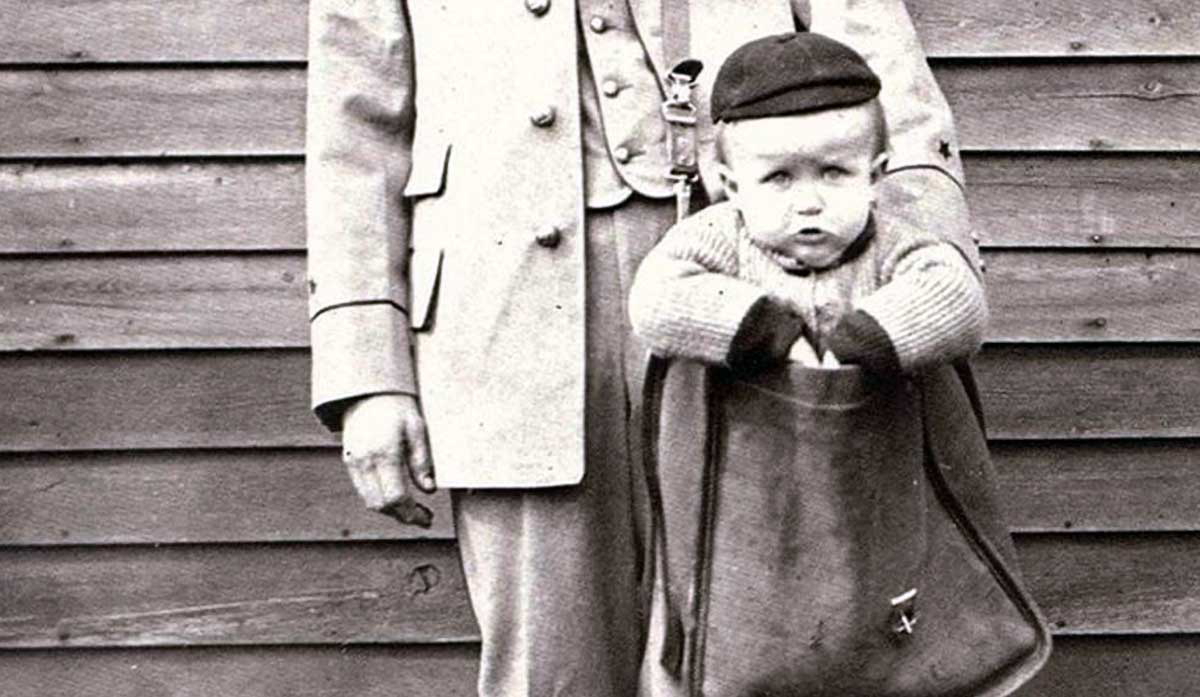 mailman with baby in bag