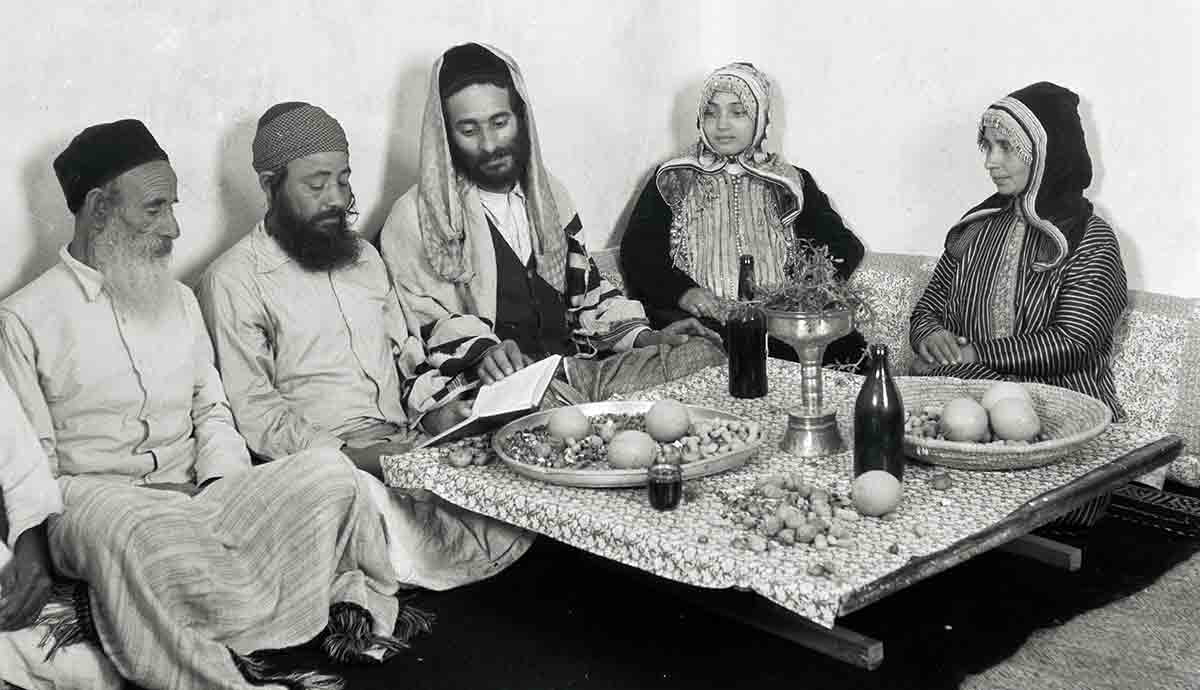 a yemenite family reading from the psalms on shabbat photograph